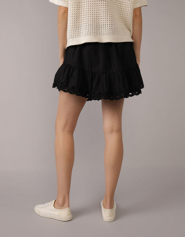Falda mini de tiro alto bordada con ojales - Negro