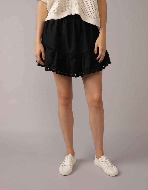 Falda mini de tiro alto bordada con ojales - Negro